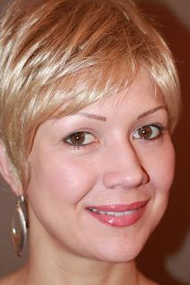 young woman with permanent faux eyebrows and wearing a wig