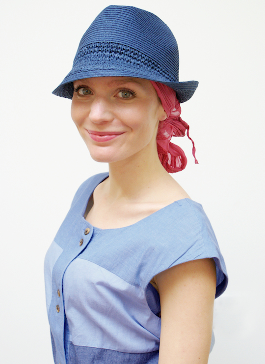 women wearing blue trilby summer hat and sun dress