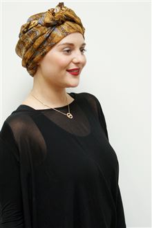 Gold silk scarf worn as head wrap on model with black evening dress