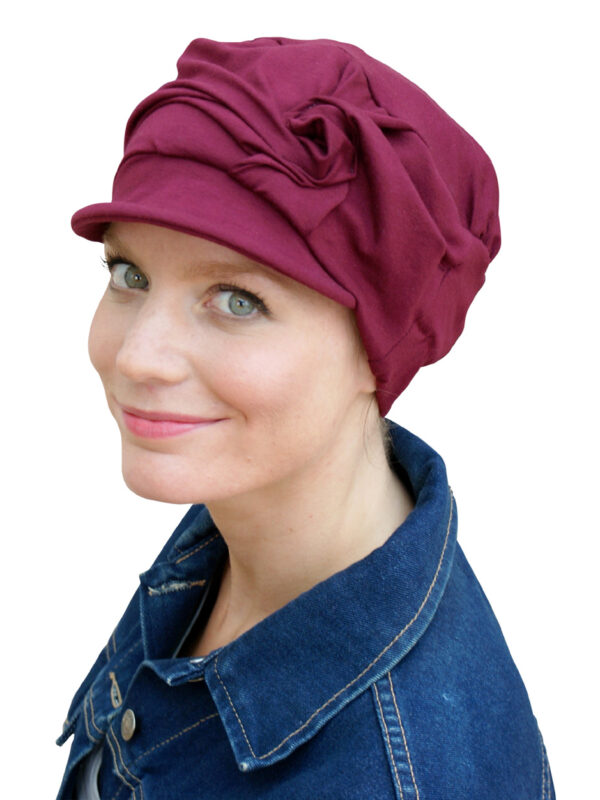 Red chemo hat close-up on woman's head
