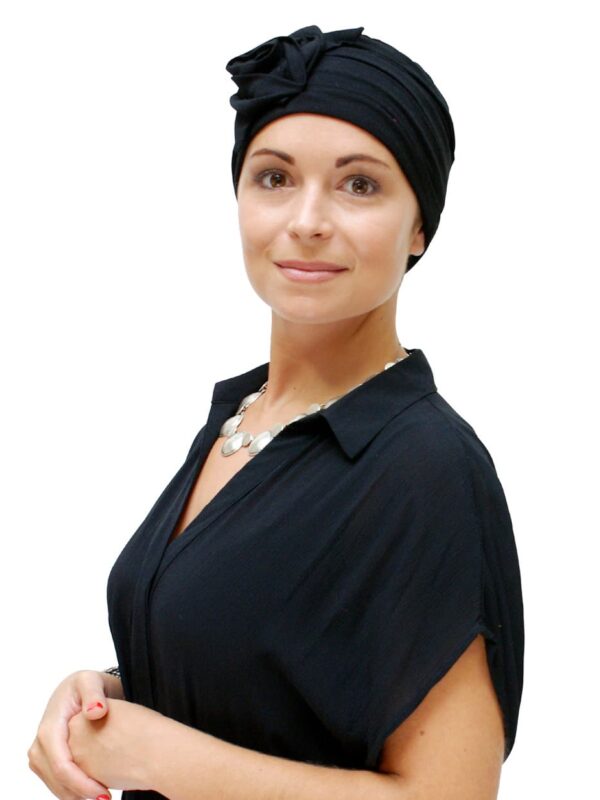 woman wearing black jersey hat for hair loss
