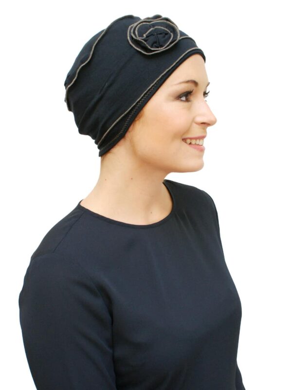 blue chemo hat worn by young woman