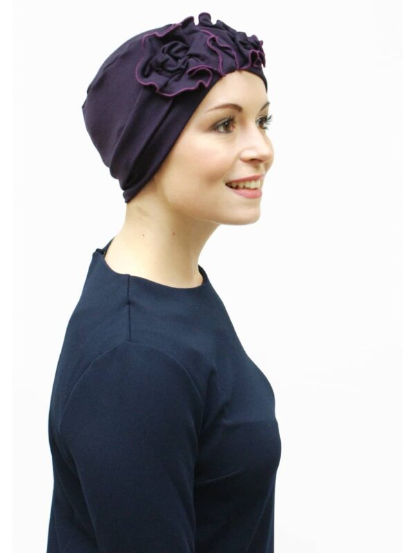 purple chemo hat worn by woman