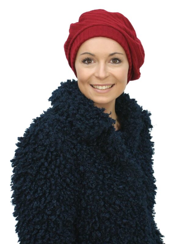 red chemo beret worn by young woman
