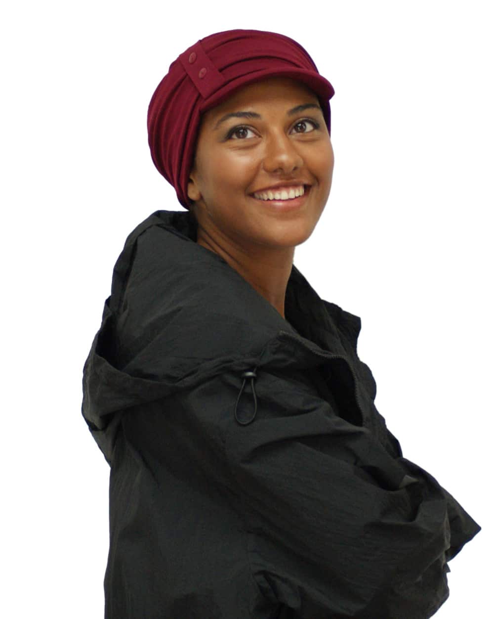 soft red chemo cap worn by young woman