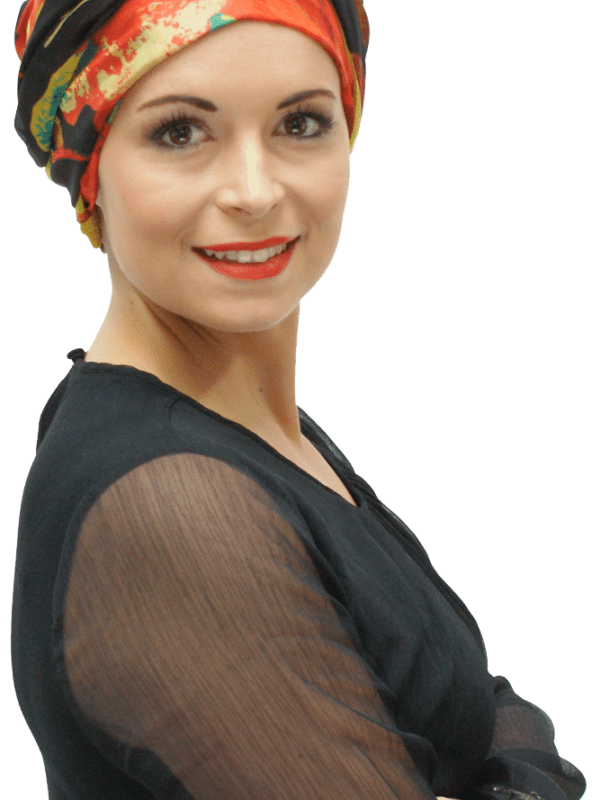 orange and black chemo headscarf worn as turban