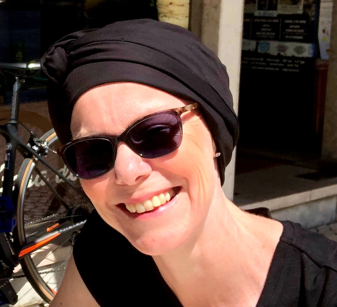 woman with alopecia in black turban
