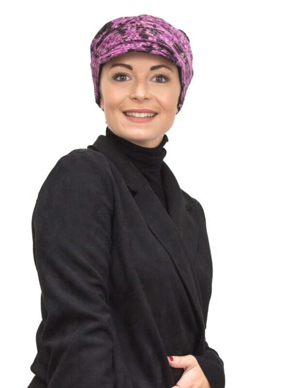 pink velour chemo cap on woman's head