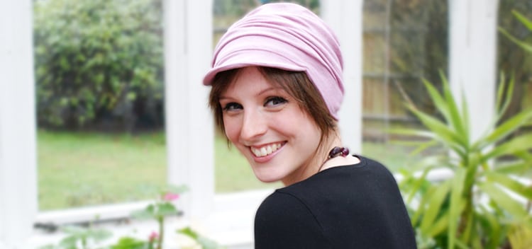 Young woman wearing pink cap