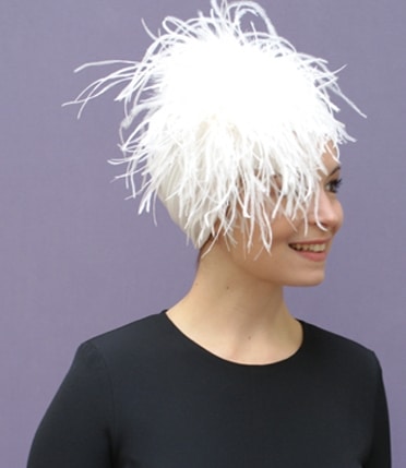 woman wearing feathered chemo turban