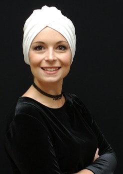 women wearing cream chemo hat