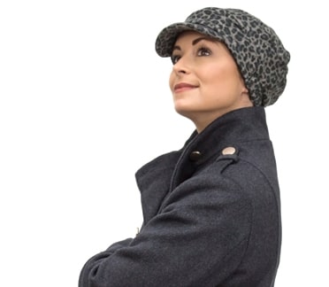 young woman wearing chemo cap