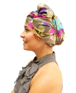 woman wearing floral silk chemo scarf