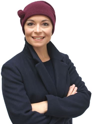 young woman wearing winter hat for hair loss