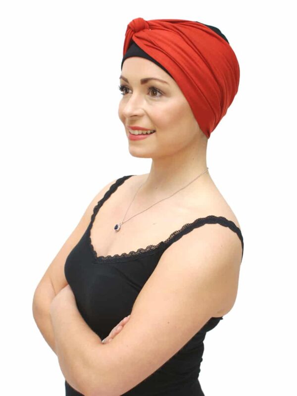 wide headband worn over turban