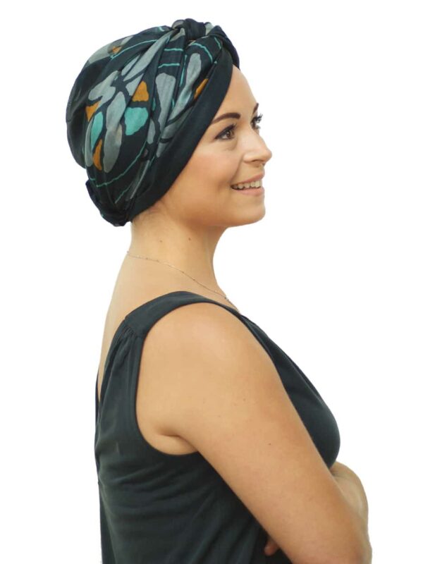 green silk head scarf worn as turban
