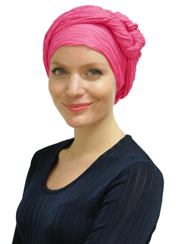 young woman wearing pink head scarf