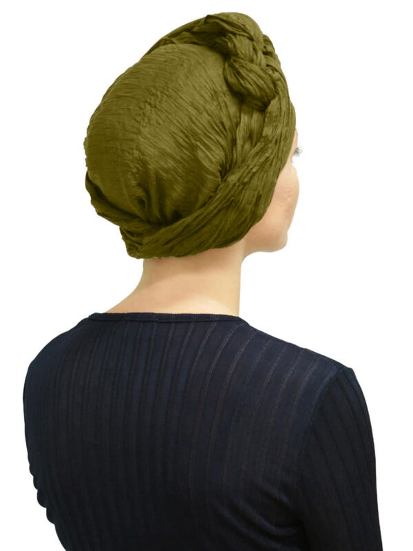 young woman wearing long green turban scarf