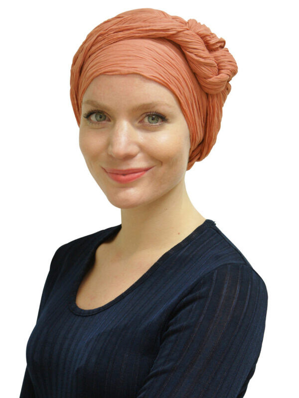 young woman wearing head scarf turban