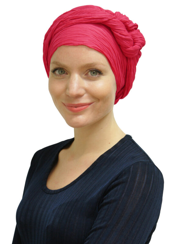 young woman wearing pink head scarf