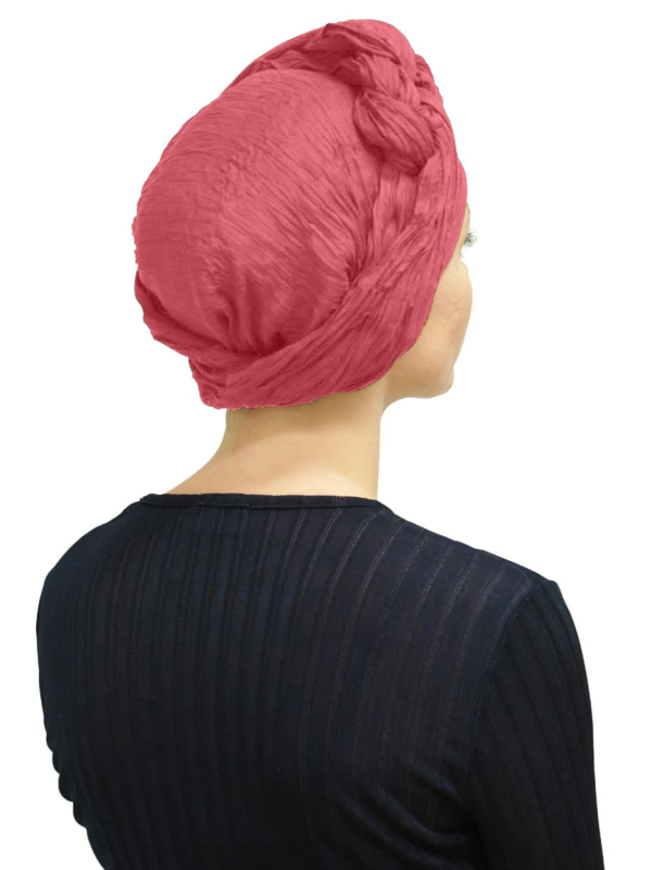 Back view of women wearing pink head scarf turban