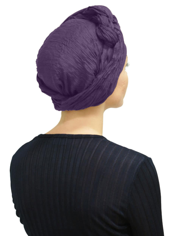 Back view of women wearing dark plum head scarf turban