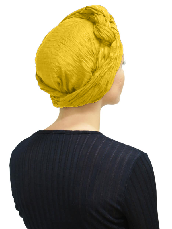 Back view of women wearing summer yellow head scarf turban