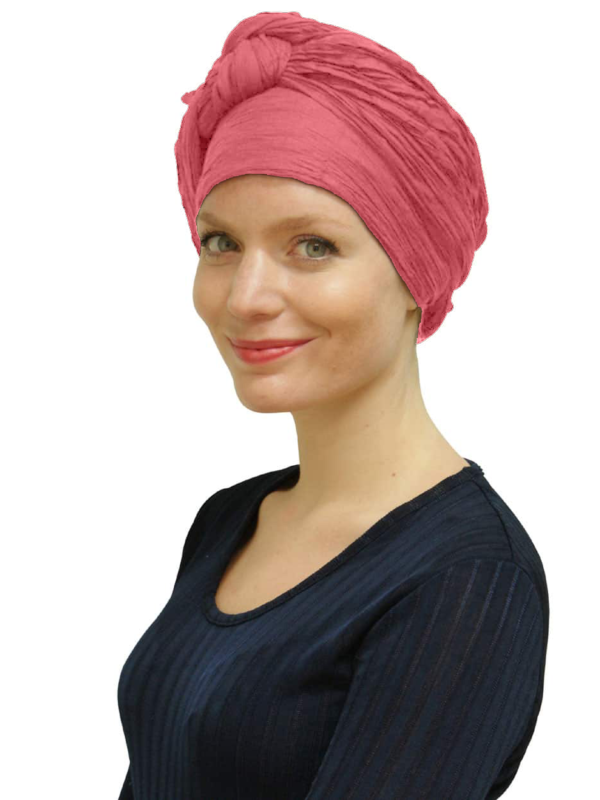 Woman wearing pink head scarf turban