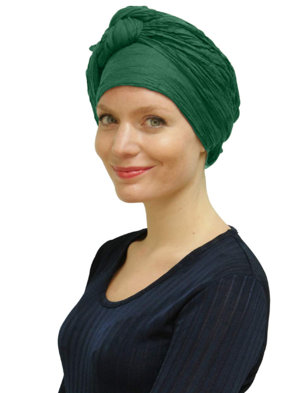 Woman wearing emerald green head scarf turban