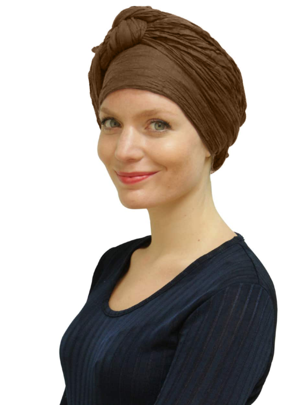 Woman wearing cocoa head scarf turban