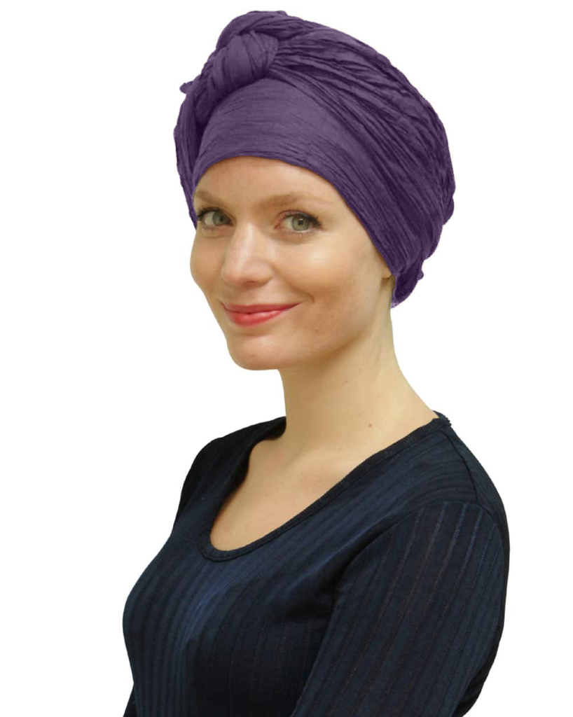 Woman wearing dark plum head scarf turban