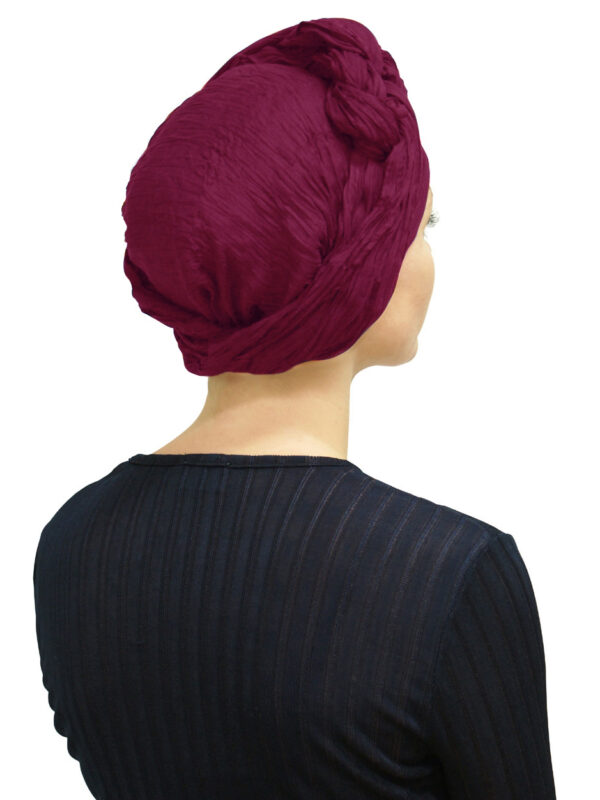 back of woman wearing head scarf