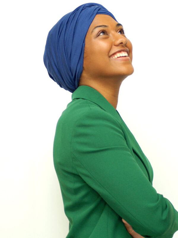 woman of colour wearing blue head wrap