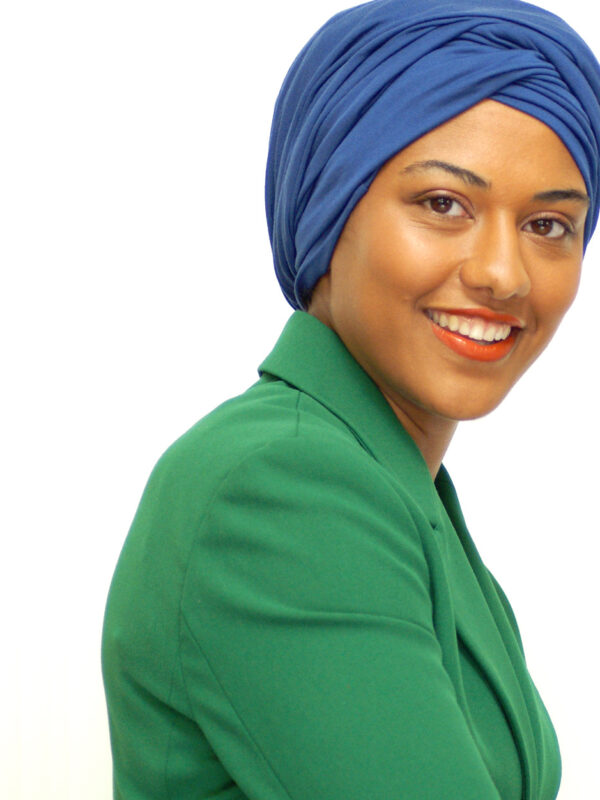 woman of colour wearing blue head wrap