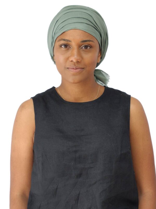 green chemo scarf tied as a turban