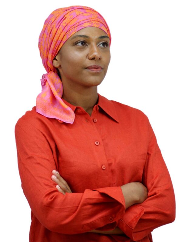 pink and orange chemo scarf worn as a turban for hair loss