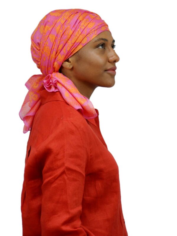orange chemo scarf worn as a head scarf to cover hair loss
