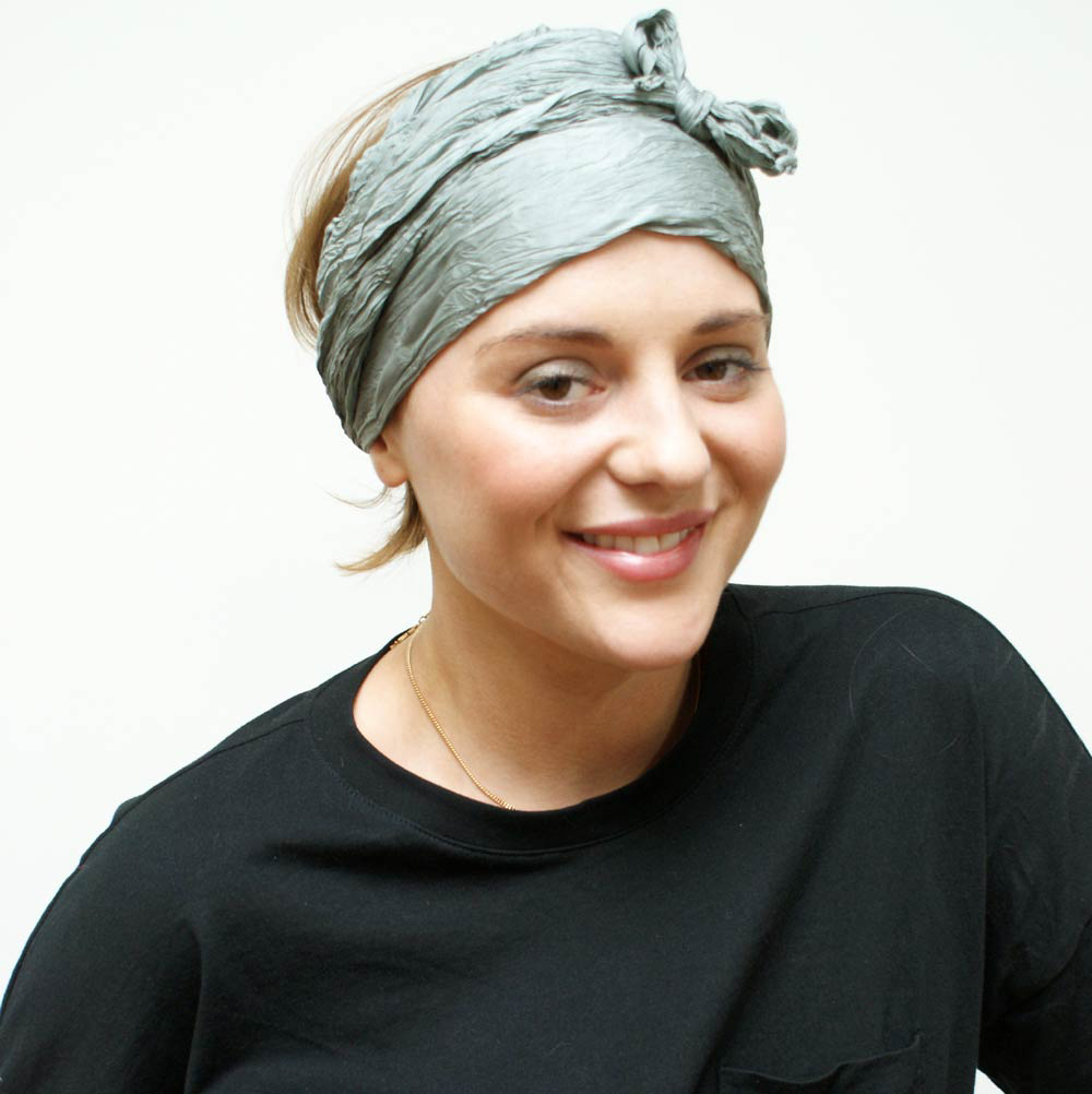Silk headband scarf worn with wide coverage and small bow at forehead, hair loss style