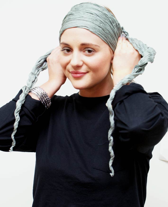 Folding a wide headband scarf for hair loss into a triangle